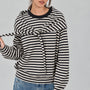 Front studio view of the Remi black and cream striped cotton sweatshirt with matching triangle scarf tied around the hips
