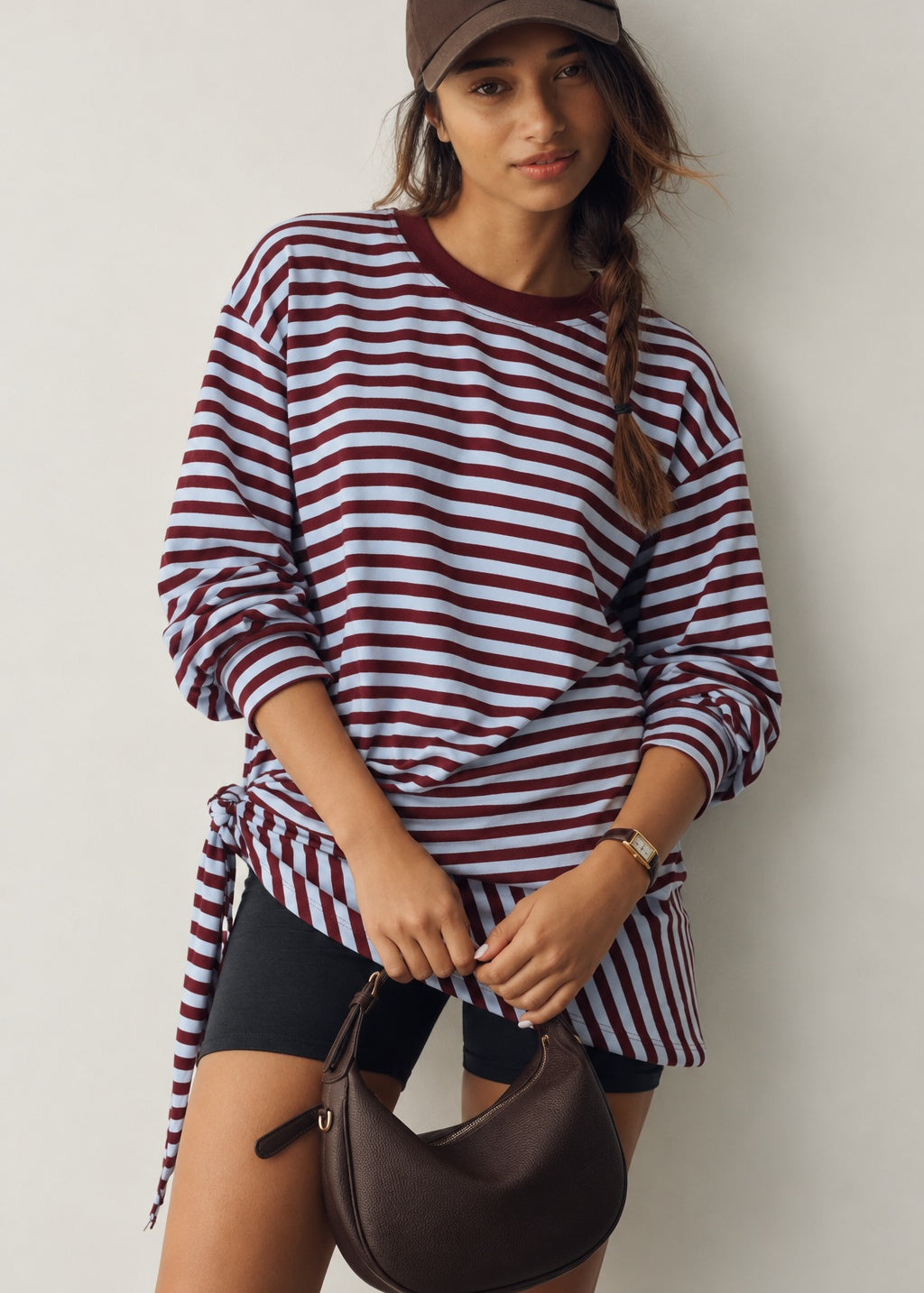 Front view of the Remi wine and blue striped sweatshirt with matching triangle scarf tied around the hips