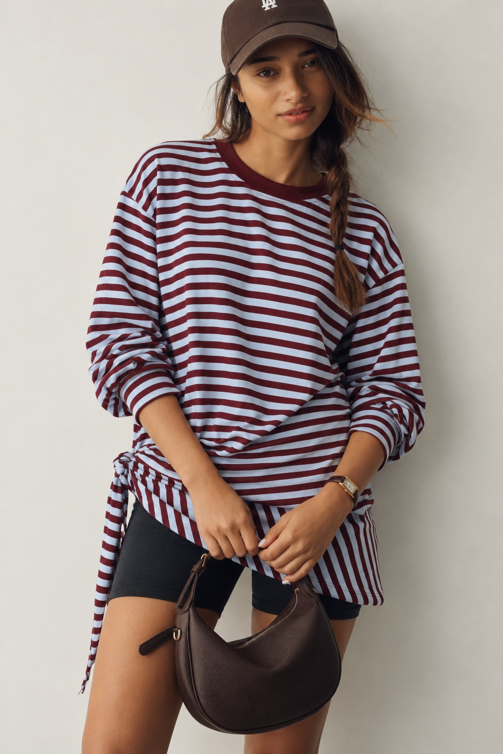 Front view of the Remi wine and blue striped sweatshirt with matching triangle scarf tied around the hips