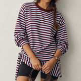 Front view of the Remi wine and blue striped sweatshirt with matching triangle scarf tied around the hips
