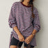 Front view of the Remi wine and blue striped sweatshirt with matching triangle scarf tied around the hips