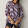 Front view of the Remi wine and blue striped sweatshirt with matching triangle scarf tied around the hips