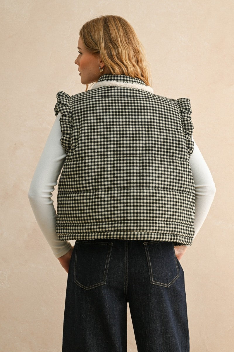 Back view of the black gingham puffer vest showing the quilted silhouette and relaxed fit
