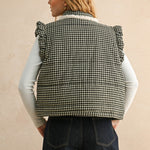 Back view of the black gingham puffer vest showing the quilted silhouette and relaxed fit