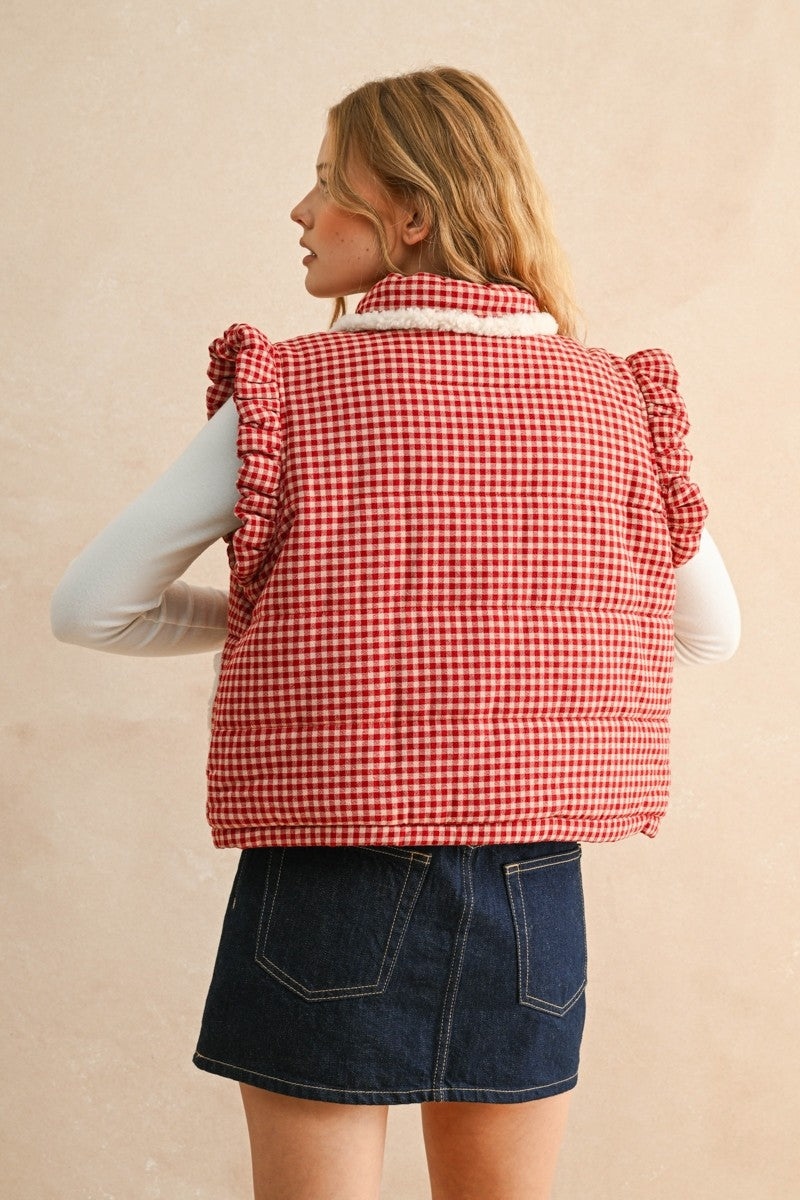Back view of the red gingham puffer vest showing quilted texture and relaxed fit