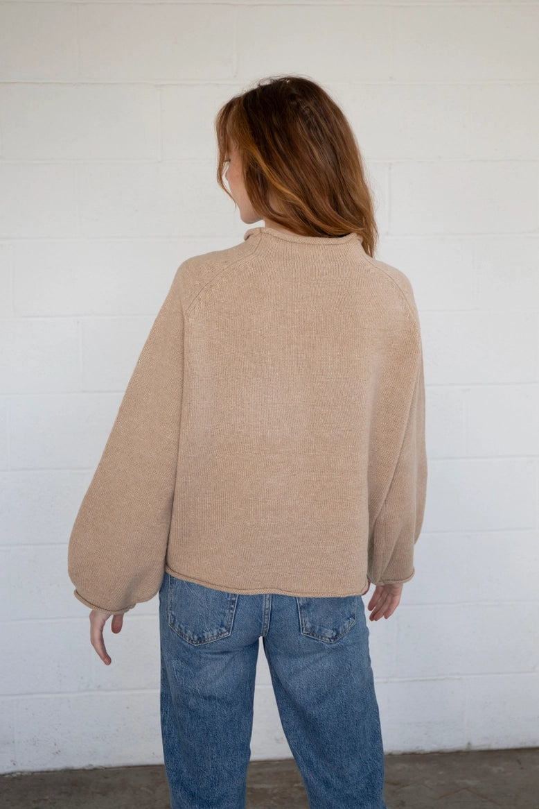 Back view of the Sardine Balloon Sleeve Sweater in oat showing relaxed silhouette