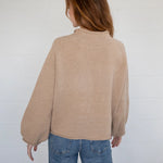 Back view of the Sardine Balloon Sleeve Sweater in oat showing relaxed silhouette