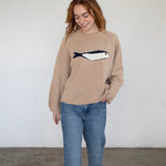 Full-body front view of the Sardine Balloon Sleeve Sweater in oat with relaxed fit