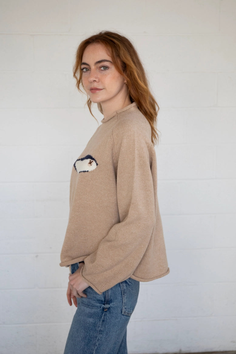 Side view of the oat balloon sleeve sweater showing sleeve volume and drape