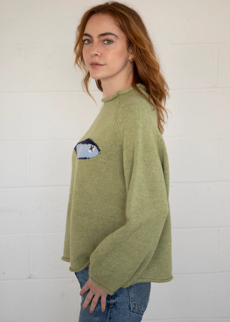 Side view of the Sardine Balloon Sleeve Sweater in olive showing sleeve volume and drape