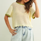 Scalloped mesh knit short sleeve top in cream with sage trim styled with casual outfit