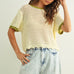 Scalloped mesh knit short sleeve top in cream with sage trim styled with casual outfit