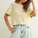Scalloped mesh knit short sleeve top in cream with sage trim styled with casual outfit