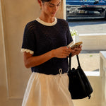 Navy and cream scalloped mesh knit short sleeve top styled for an easy everyday outfit.
