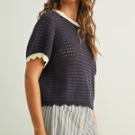 Side view of Scalloped Mesh Knit Short Sleeve Top in navy and cream with breathable cotton mesh knit and relaxed fit.