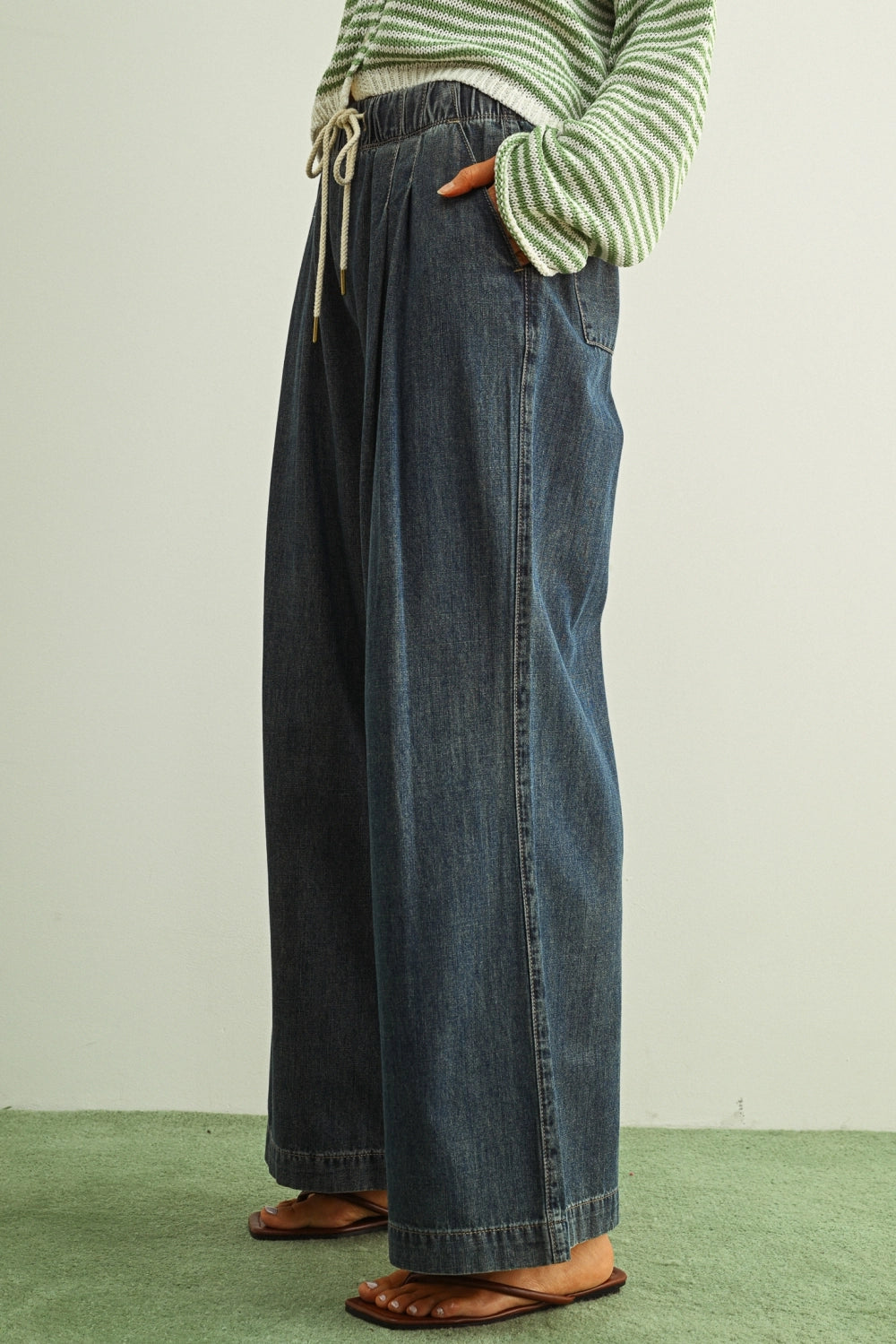 Scout Lightweight Pull-On Wide Leg Jeans in denim, side view showing soft lightweight fabric, front pleats, and relaxed wide leg silhouette