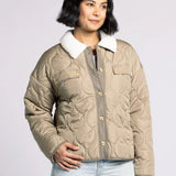 Woman wearing the Aura Sherpa Collar Quilted Puffer Coat in olive — soft quilted outerwear with cozy sherpa collar.