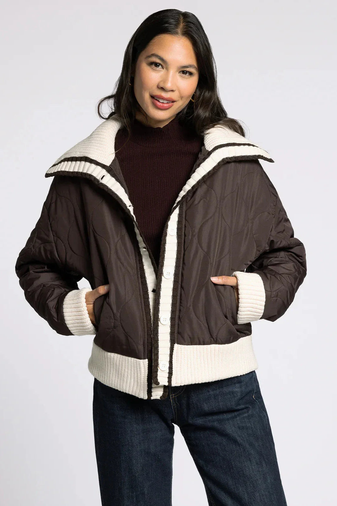 Front portrait view of model wearing the Sienna Knit Collar Puffer Jacket in brown with knit collar and trim