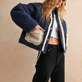 Close-up of sherpa-trimmed pocket detail on the Sienna quilted jacket in blue