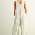 Back view of Sienna cream and black striped viscose linen jumpsuit with wide-leg silhouette