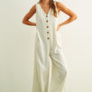 Sienna striped button-front jumpsuit in cream and black with wide-leg silhouette and side pockets