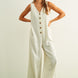 Sienna striped button-front jumpsuit in cream and black with wide-leg silhouette and side pockets