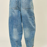 Silverton medium wash barrel jeans, back view with relaxed fit and seam detailing