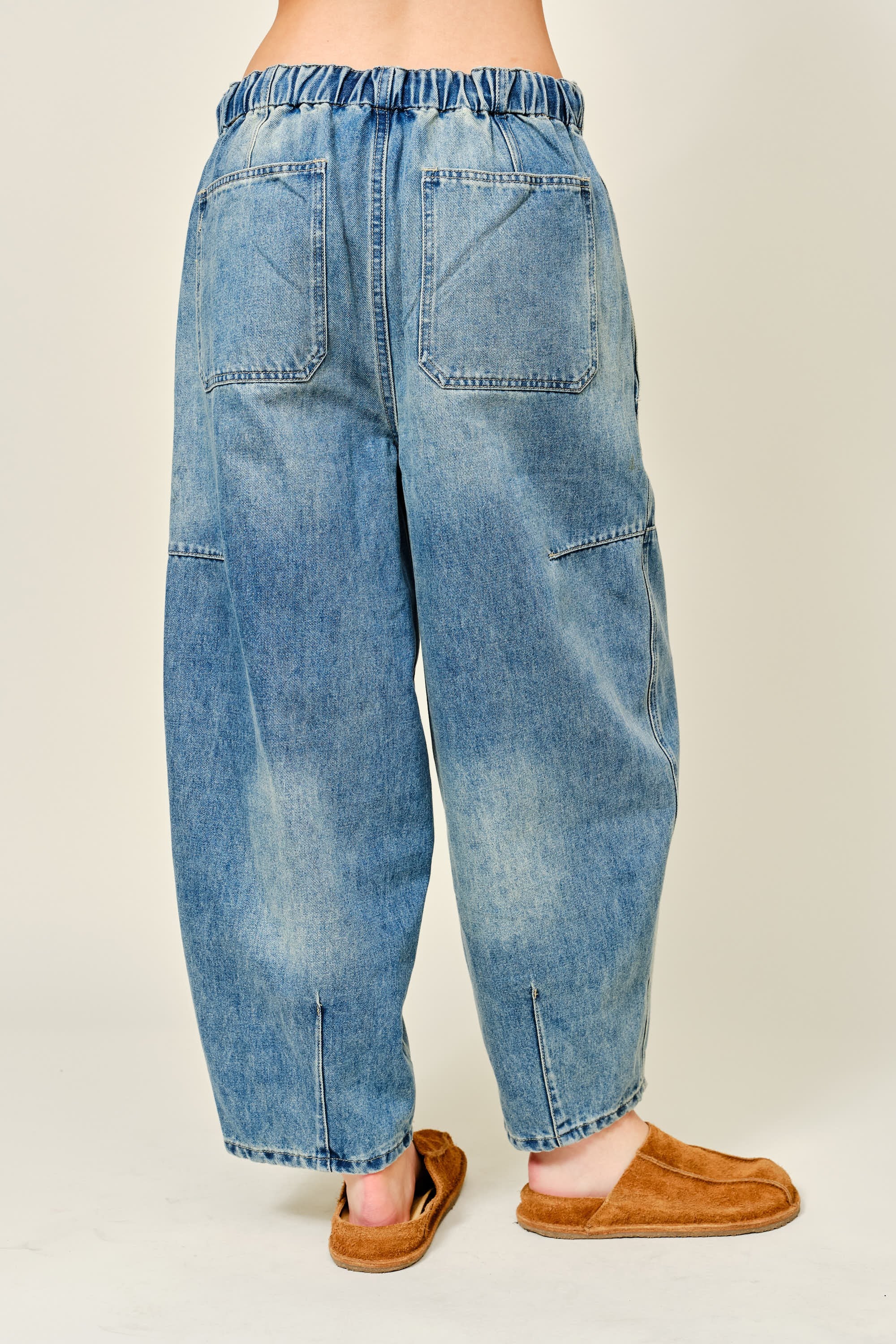 Silverton medium wash barrel jeans, back view with relaxed fit and seam detailing