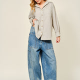 Silverton medium wash barrel jeans styled in a full outfit with relaxed wide-leg silhouette