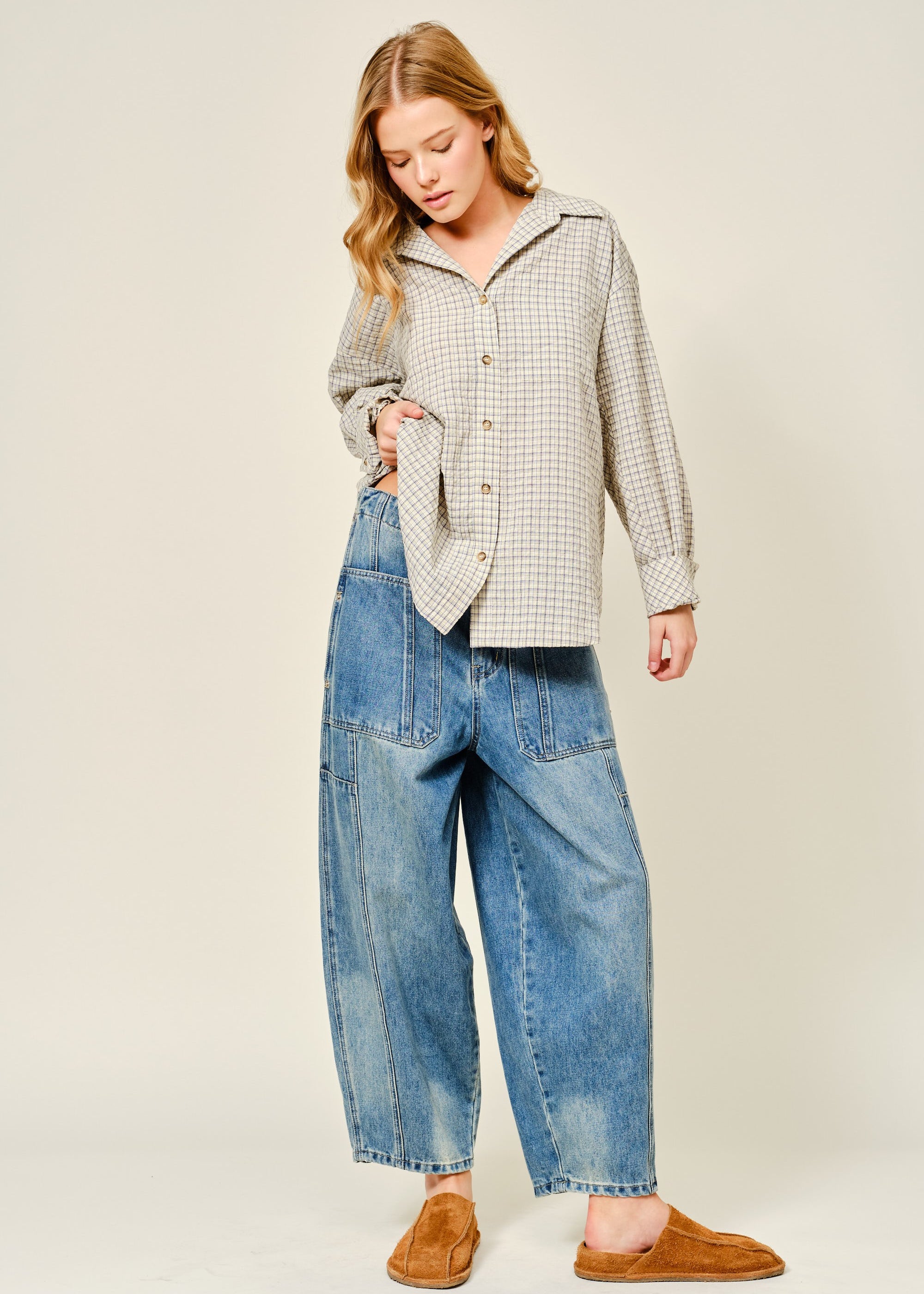 Silverton medium wash barrel jeans styled in a full outfit with relaxed wide-leg silhouette