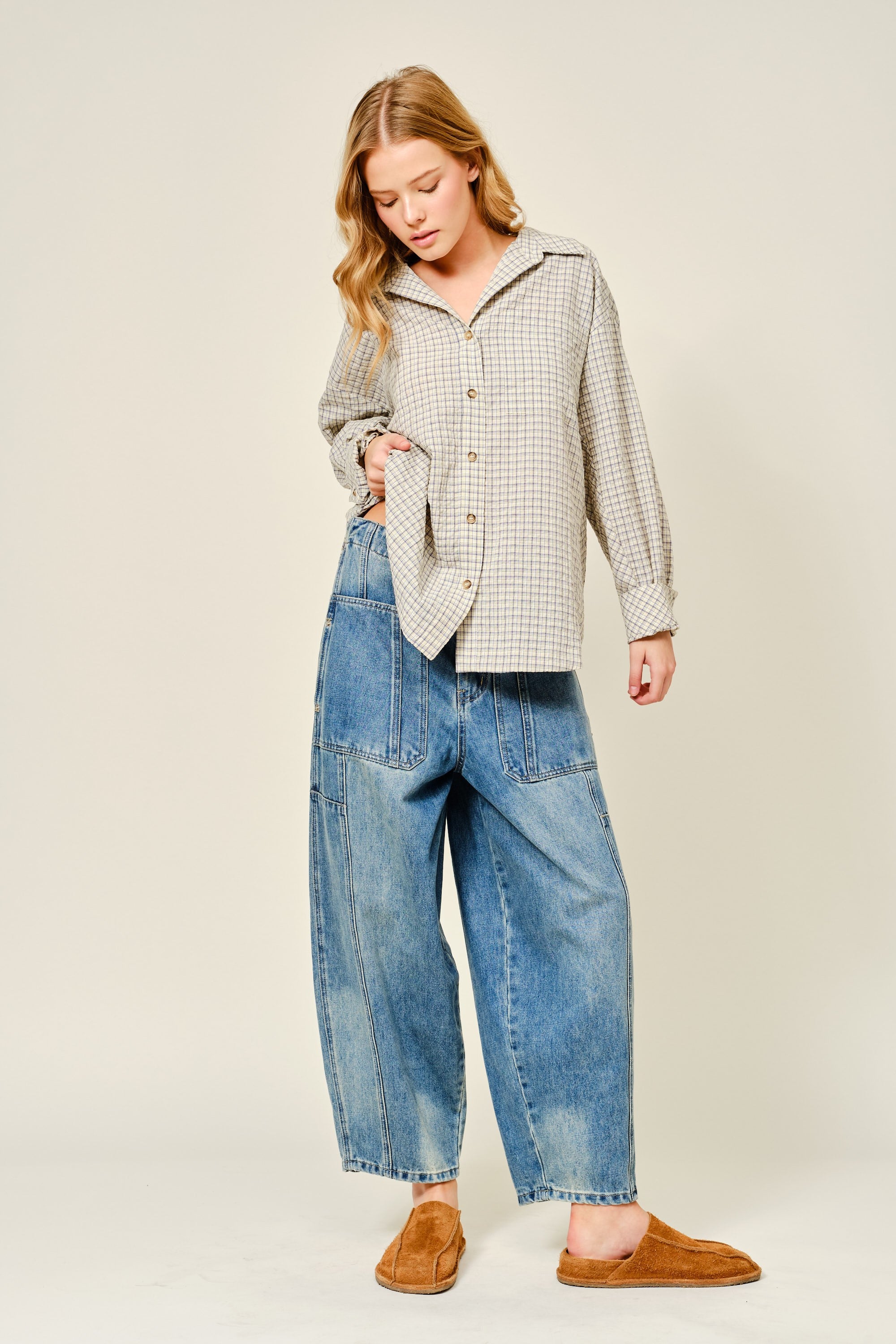 Silverton medium wash barrel jeans styled in a full outfit with relaxed wide-leg silhouette