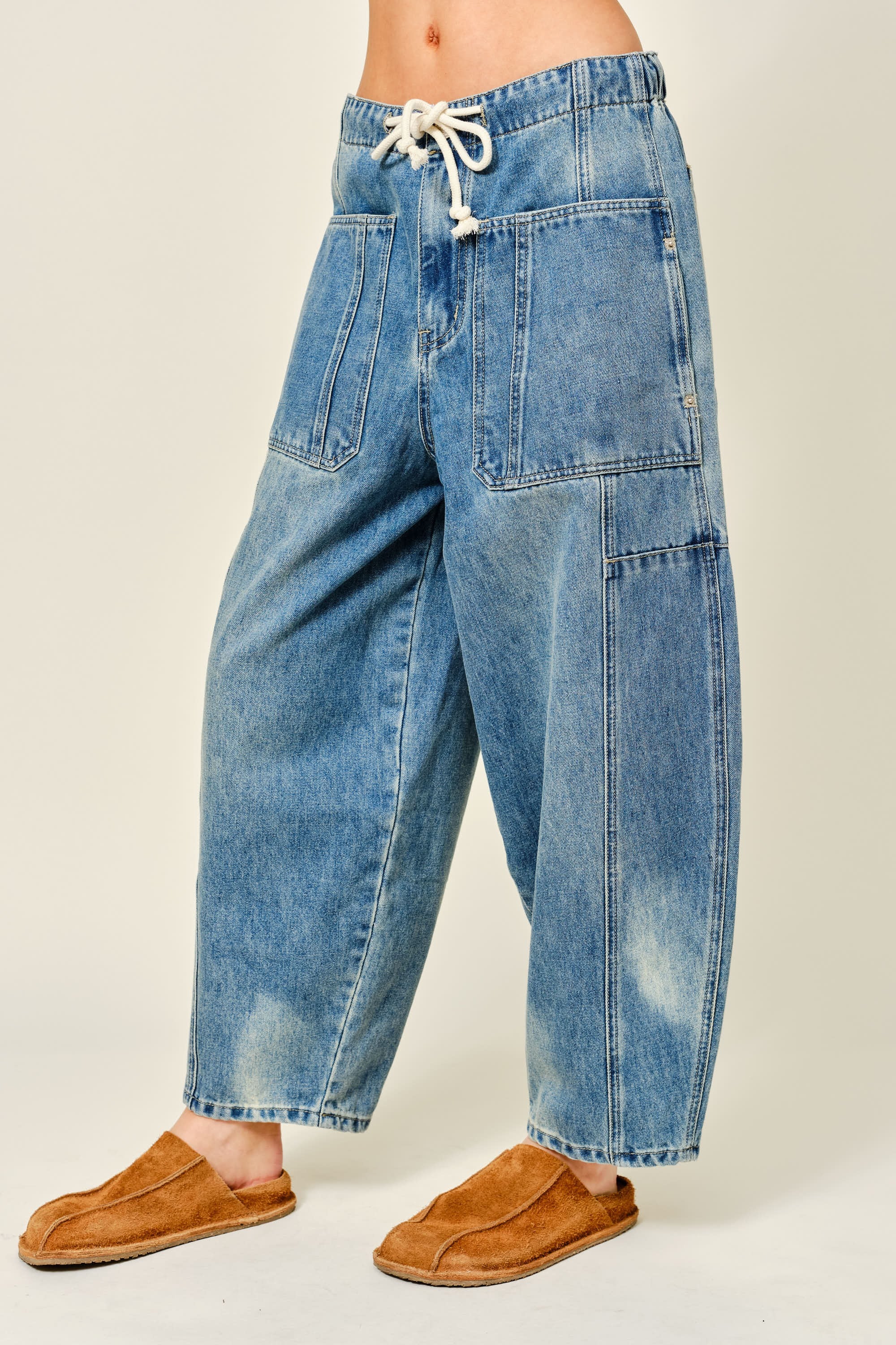 Silverton drawstring barrel jeans in medium wash, side view showing balloon leg shape