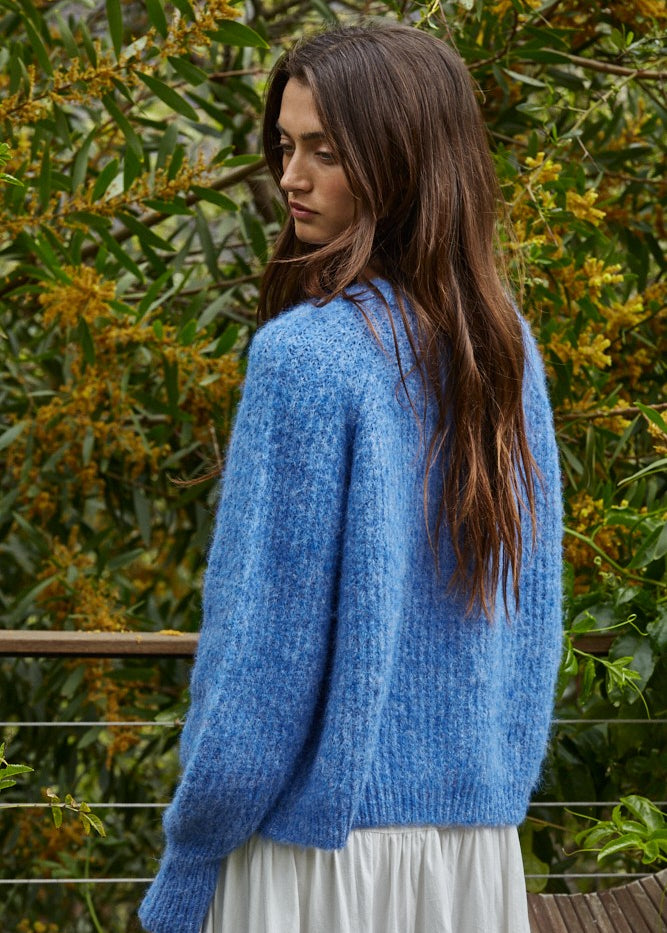 Back view of the Skyline Crew Neck Button Cardigan in cobalt blue, raglan sleeves and relaxed silhouette