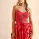 Close-up of smocked bodice on cherry gingham cotton maxi dress