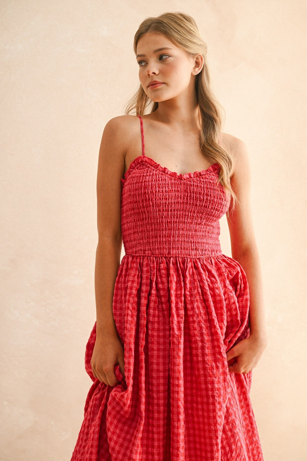 Close-up of smocked bodice on cherry gingham cotton maxi dress