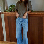 Full body view of soft balloon sleeve short sleeve sweater styled casually in dark mocha