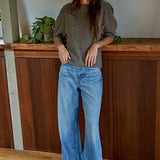 Full body view of soft balloon sleeve short sleeve sweater styled casually in dark mocha