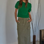 Full body view of soft balloon sleeve short sleeve sweater styled casually in kelly green