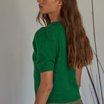 Side view of soft balloon sleeve short sleeve sweater in kelly green