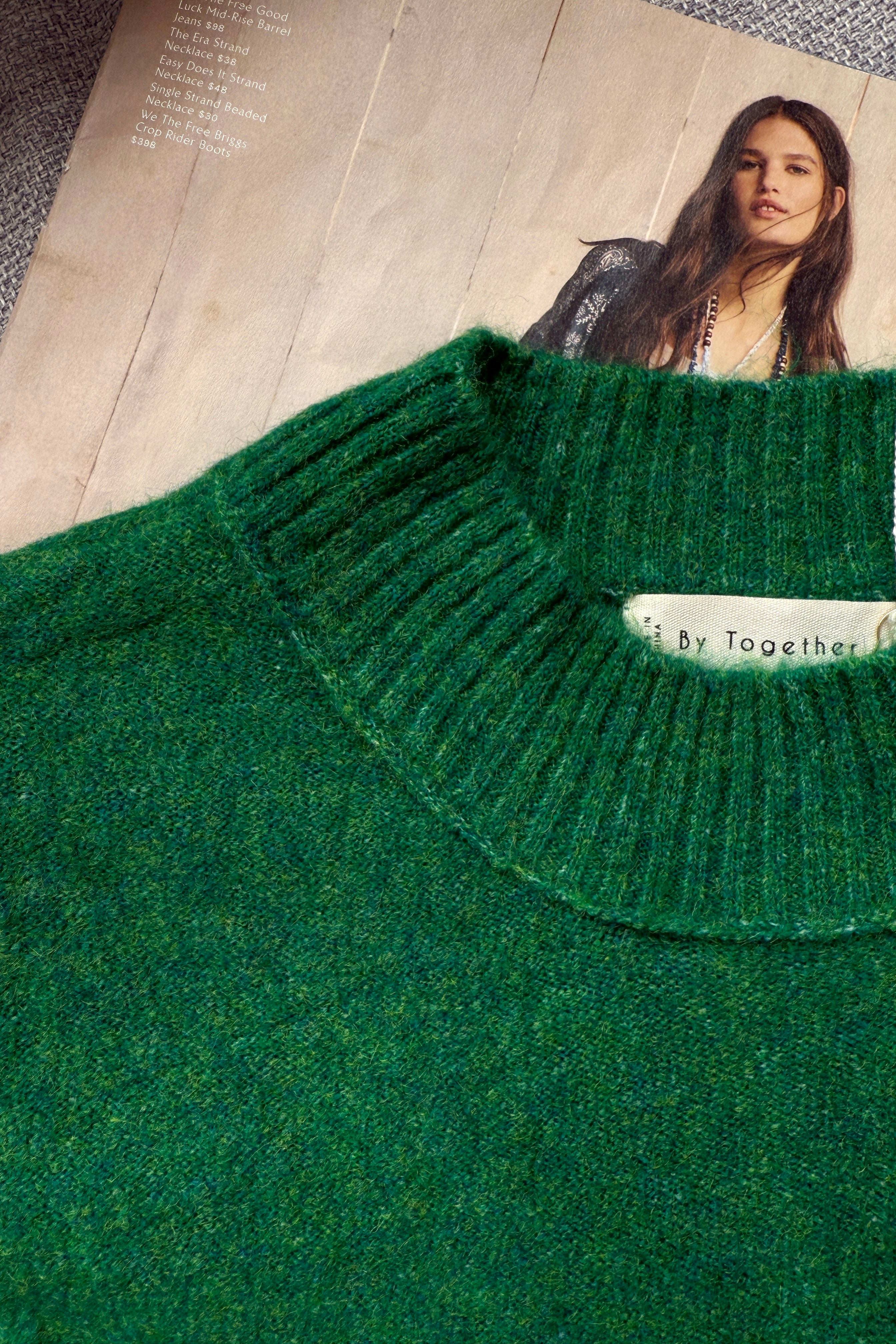 Close-up of lightweight knit texture on soft balloon sleeve sweater in kelly green