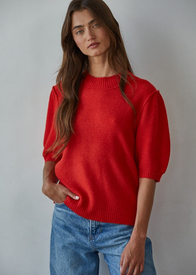 Model wearing the Soft Balloon Sleeve Short Sleeve Sweater in red, front portrait view