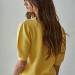 Back view of the Soft Balloon Sleeve Short Sleeve Sweater in yellow, relaxed fit