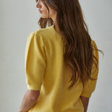 Back view of the Soft Balloon Sleeve Short Sleeve Sweater in yellow, relaxed fit