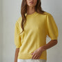 Model wearing the Soft Balloon Sleeve Short Sleeve Sweater in yellow, front portrait view