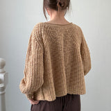 Back view of SoftSpun beige textured knit sweater with airy lightweight design