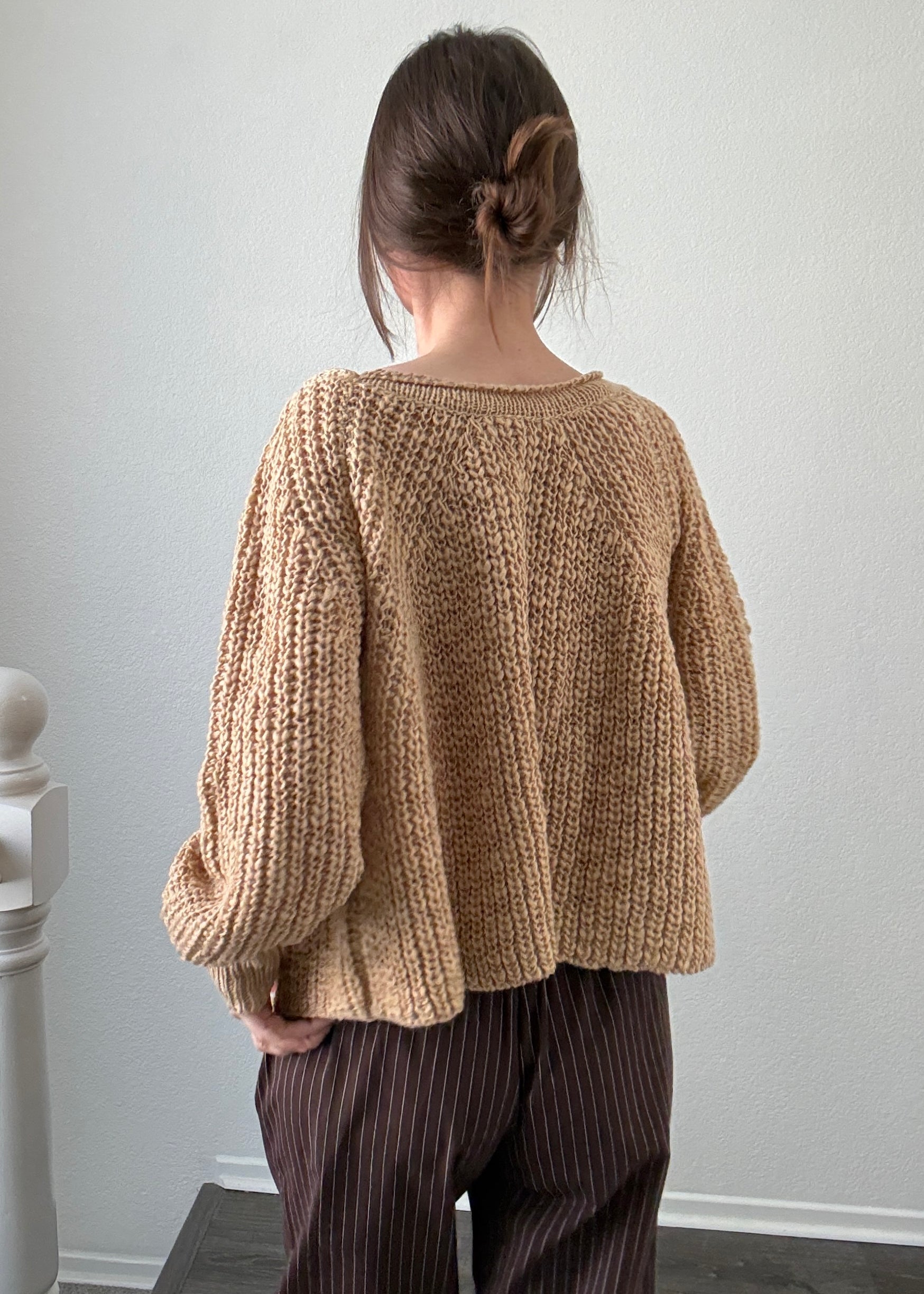 Back view of SoftSpun beige textured knit sweater with airy lightweight design