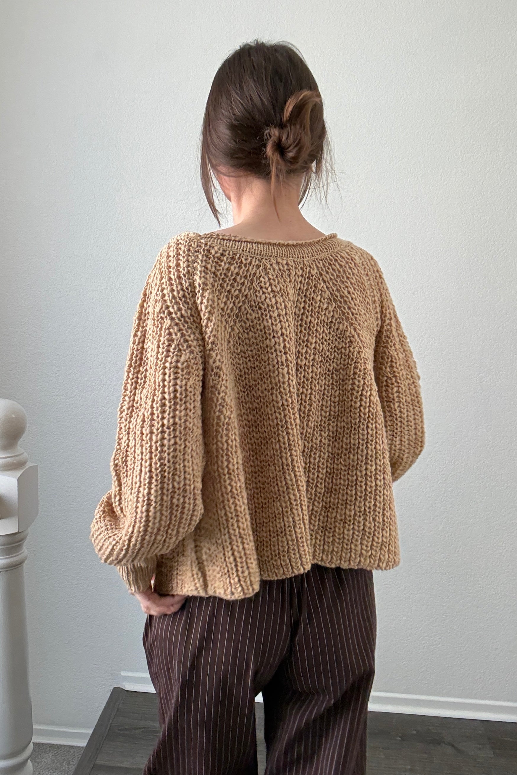 Back view of SoftSpun beige textured knit sweater with airy lightweight design