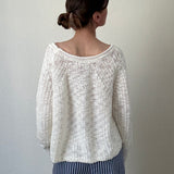Back view of SoftSpun cream textured knit sweater with airy lightweight design