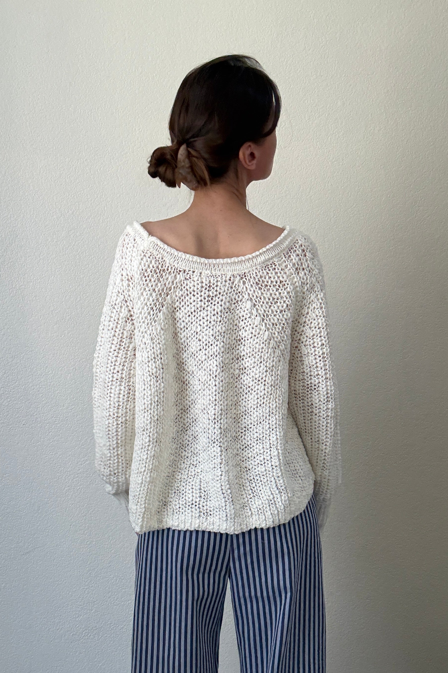Back view of SoftSpun cream textured knit sweater with airy lightweight design