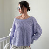 Woman wearing  SoftSpun textured boatneck sweater in lavender, front view with relaxed fit and airy knit